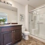 This main level suite bath is oversized for added convenience.