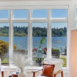 Walls of windows throughout, inviting the amazing lake views and natural light.