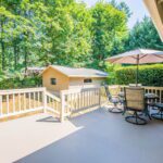 Stepping out the upper level family room is this large, brand new, solid-surface deck!