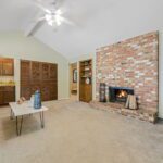 With a double-sided, see-through fireplace, the opposite side is yet another spacious family room! This room even includes a wet bar for all your entertaining.