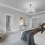 Quality details including a tray ceiling and another Restoration Hardware chandelier.